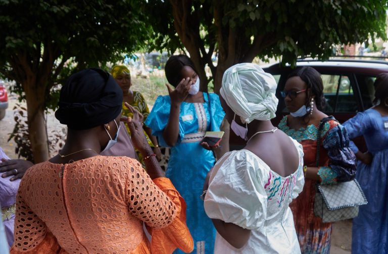 Women talking under trees in Mali