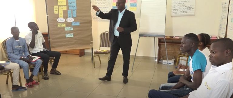 Trainer delivering training in Benin